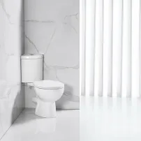 Тоалетна чиния Inter Ceramic Rimless в бяло с ъглово казанче и капак с бързо освобождаване